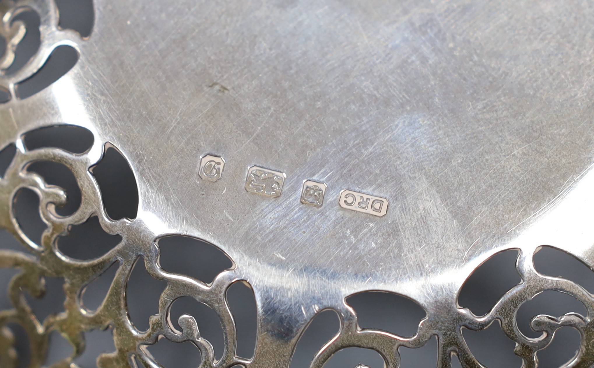 A silver bon bon dish by DRC, London, 1978, 14.1cm and a small silver bonbon basket by Rodney Clive Pettit, London, 1983, 8.3oz.